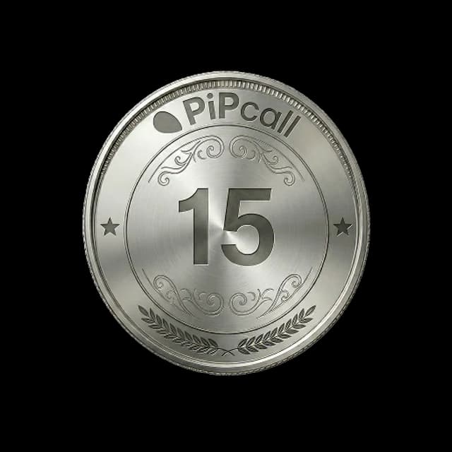 A silver commemorative coin marked 15, carrying the PiPcall wordmark — fifteen years of UK business telecoms.